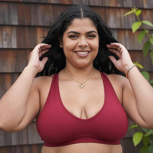 Plus-Sized Woman in Red Sports Bra Smiling