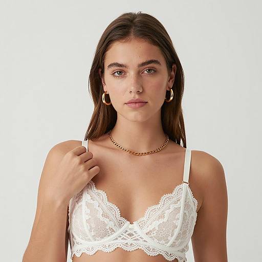 Young Woman in White Lace Bra and Gold Jewelry