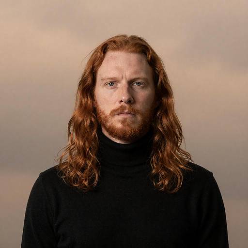 Serious Man with Long Red Hair