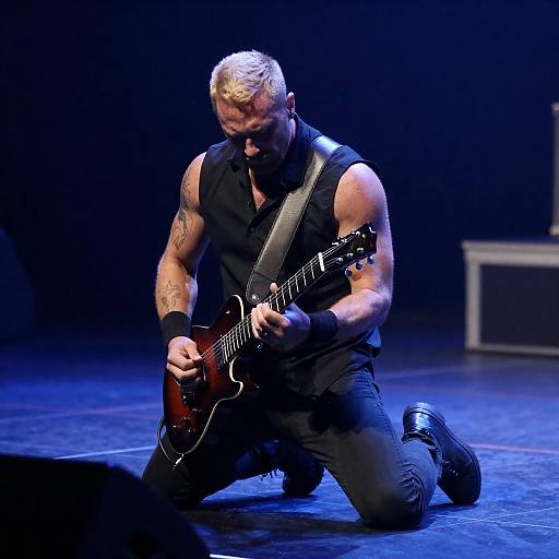 Intense Guitarist Under Blue Lights