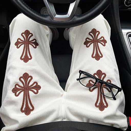 Close-Up of Embroidered Pants in Car