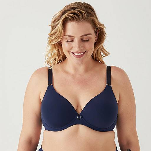 Smiling woman in dark blue underwire bra