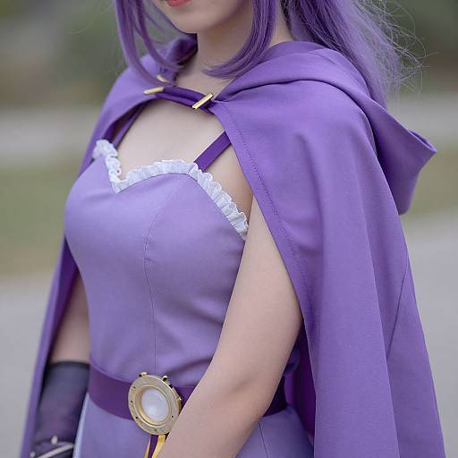 Photograph of a woman in purple cosplay attire with a hooded cape, white lace trim, and a gold belt buckle.