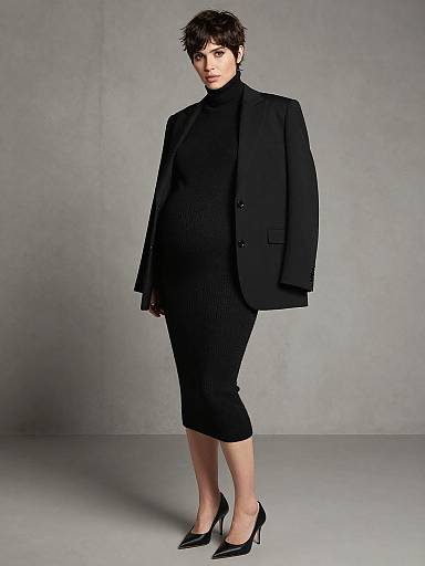 Pregnant Woman in Chic Black Outfit