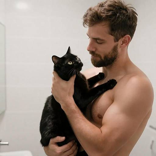 Shirtless Man Holding Black Cat