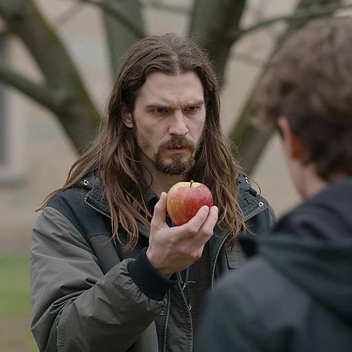 Intense Man with Apple in Nature