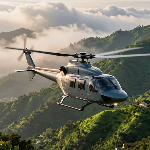 Photograph of a sleek, gray helicopter flying over lush, green, mist-covered hills at sunrise, with sunlight filtering through clouds.