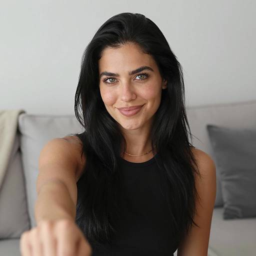 Smiling Woman on Light Gray Couch