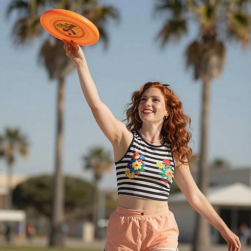 Smiling Woman Throwing Frisbee Outdoors