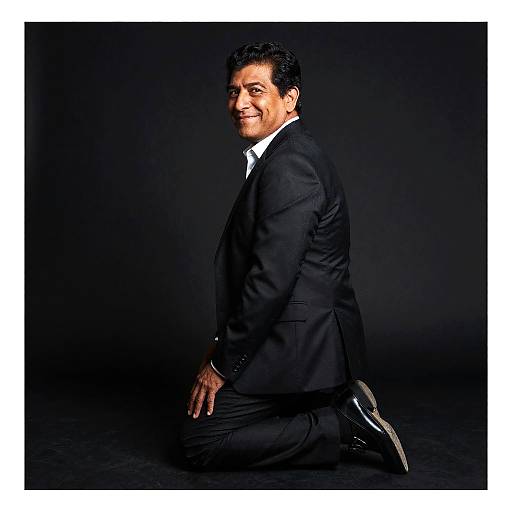 Smiling Latino Man Kneeling Portrait