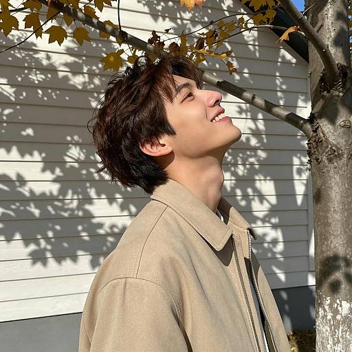Cheerful Young Man Amid Autumn Colors