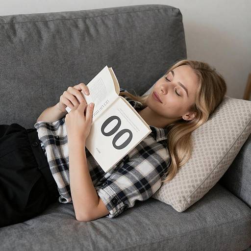 Blonde Woman Relaxing on Gray Couch