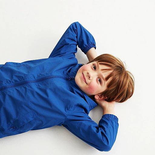 Bright-Eyed Child Reclining Portrait