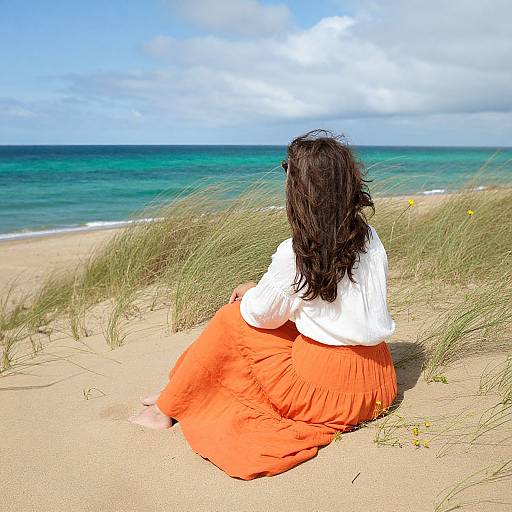 Contemplative Woman on Sandy Dune