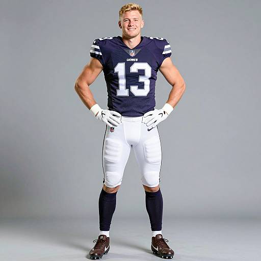 Male Football Player in Dark Purple NFL Uniform