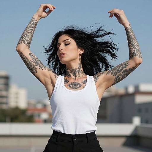 Tattooed Woman Mid-Spin in Urban Setting