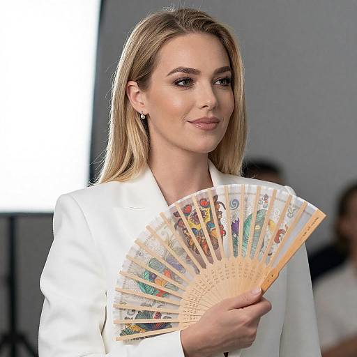 Blonde Woman Holding Ornate Folding Fan