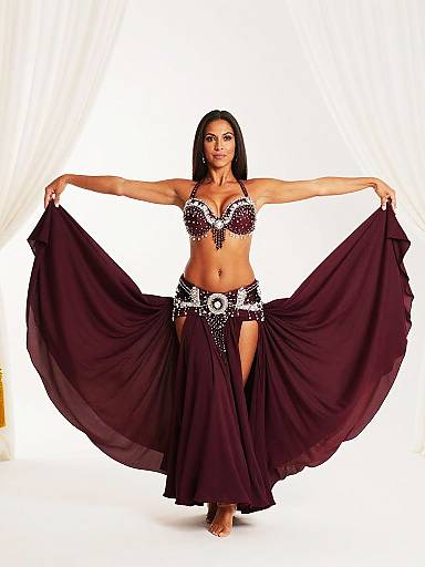 Confident Belly Dancer in Burgundy Costume