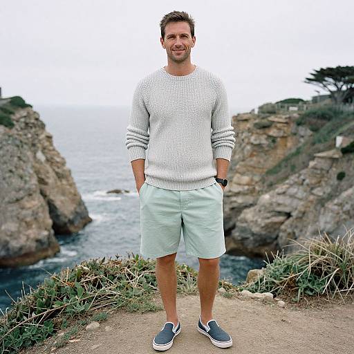 Man in Pastel Shorts by Coastal Cliffs