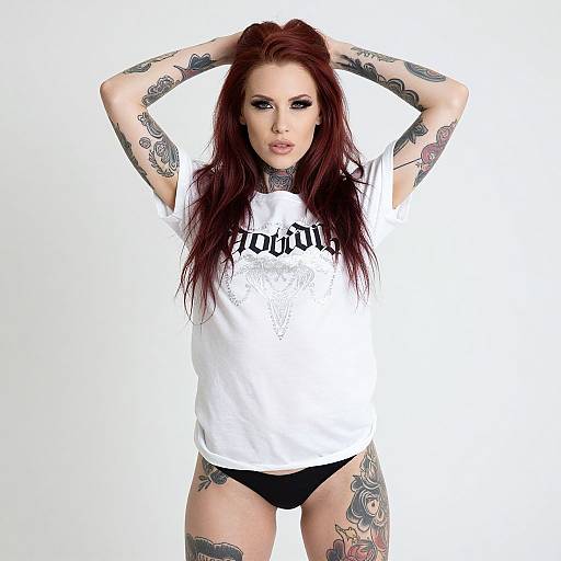 Confident Tattooed Woman in White Tee