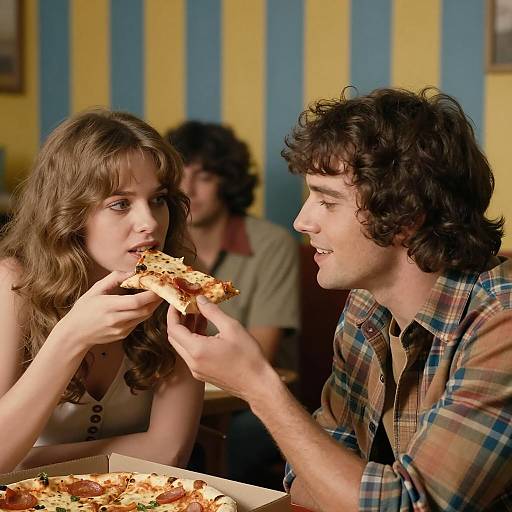 Couple Sharing Pizza in Retro Setting