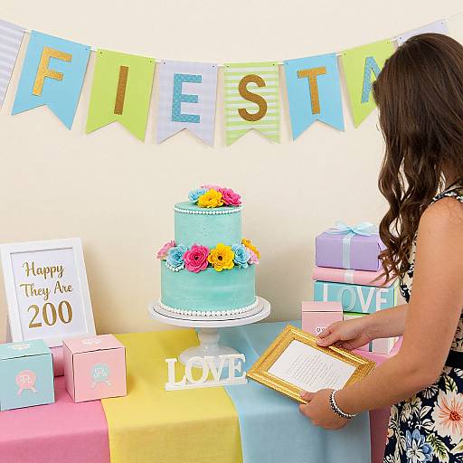 Photograph of a woman in a black floral dress, writing on a clipboard at a colorful 