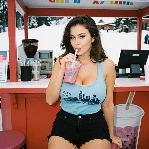Photograph of a brunette woman with large breasts, wearing a blue tank top, black shorts, sipping a pink bubble tea at a red food stall