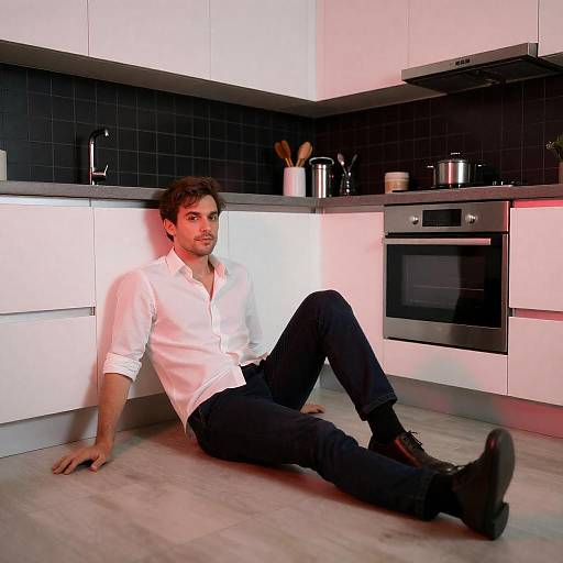 Man Sitting on Modern Kitchen Floor