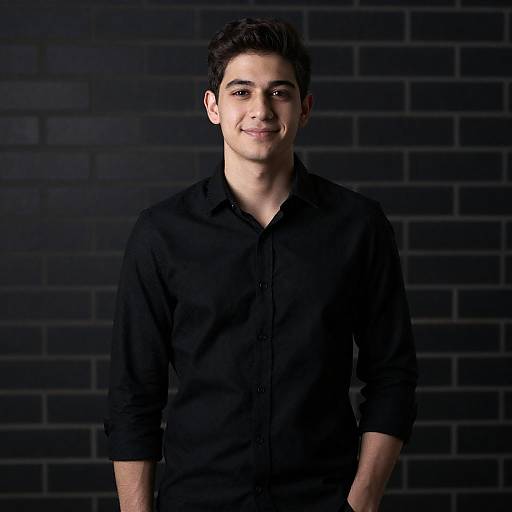 Young Man Portrait Against Dark Brick
