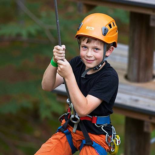 Boy Climbing with Helmet and Harness