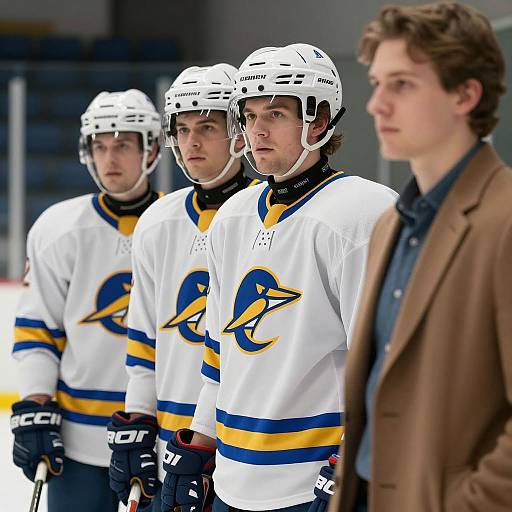 Ice Hockey Players and Coach on Rink