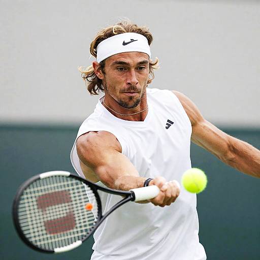 Intense Tennis Player in Action