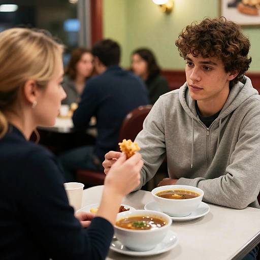 Young Man Sharing Food in Diner