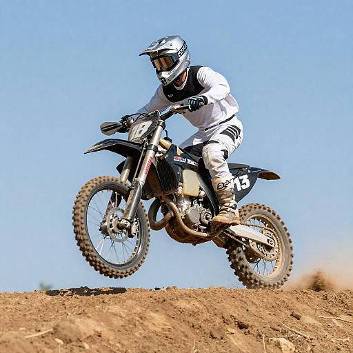 Intrepid Motorcyclist Conquering Dirt Hill