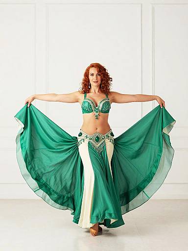 Confident Belly Dancer in Emerald Green Costume