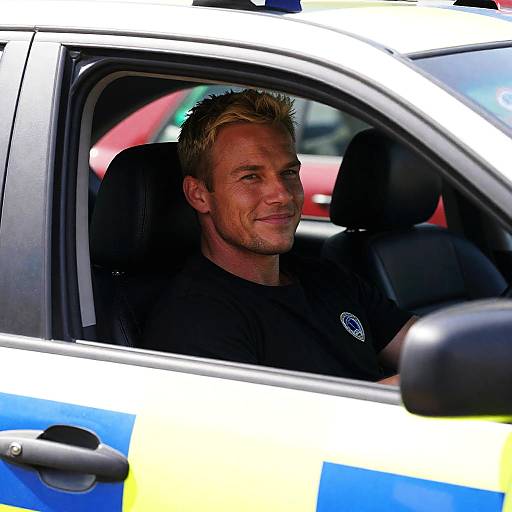 Blonde Man in Police Car Portrait