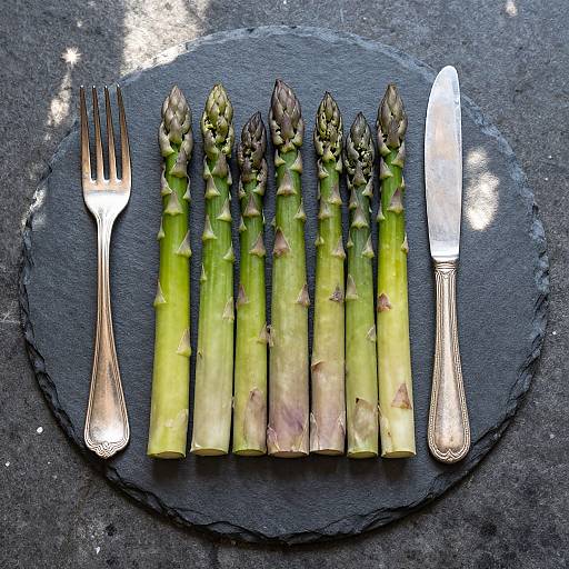 Fresh Asparagus with Silverware on Slate Plate