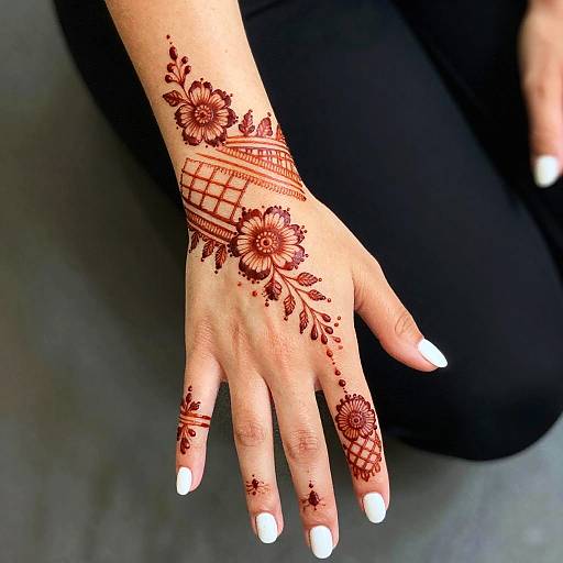 Hand with Intricate Red Henna Design