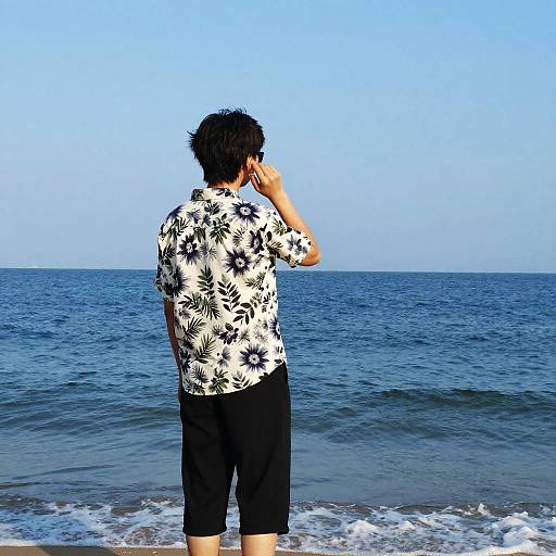 Person Listening on Ocean Beach