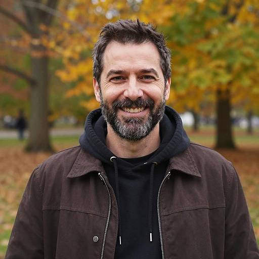 Smiling Middle-Aged Man in Autumn Park