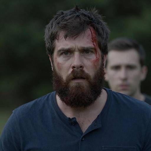 Intense Bearded Man in Dark Setting