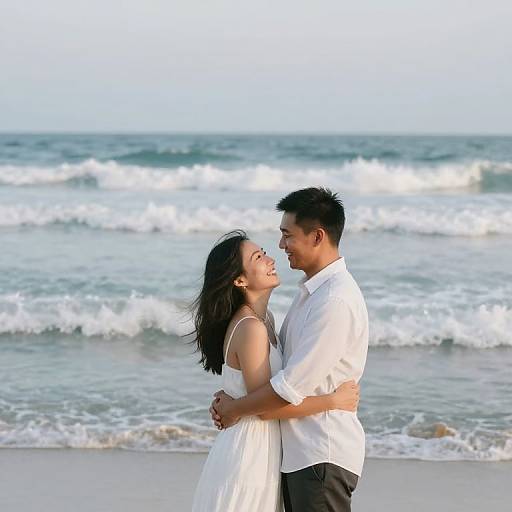 Couple Embracing on Beach by Ocean Waves