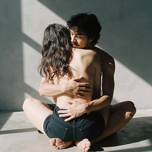 Intimate Embrace in Sunlit Shadows