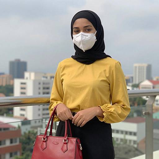Young Woman in Hijab on Balcony