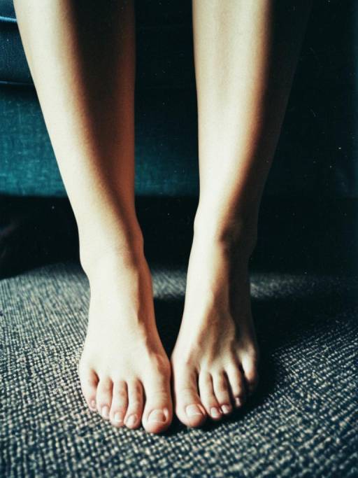 Close-up of Bare Feet on Carpet