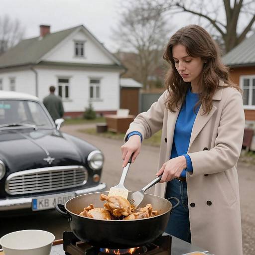 Woman Cooking Chicken with Classic Car Background