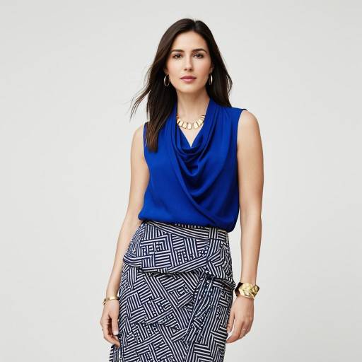 Woman in Royal Blue Blouse and Geometric Skirt