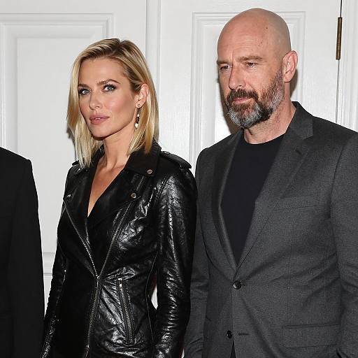 Man and Woman Standing Side by Side in Formal Attire
