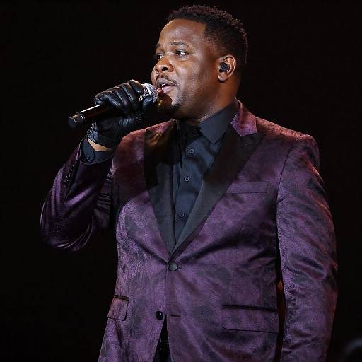 Illuminated Black Male Singer in Purple Suit