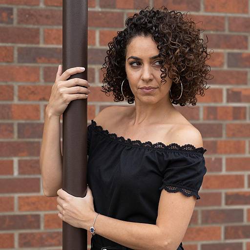 Stylish Woman by Brick Wall